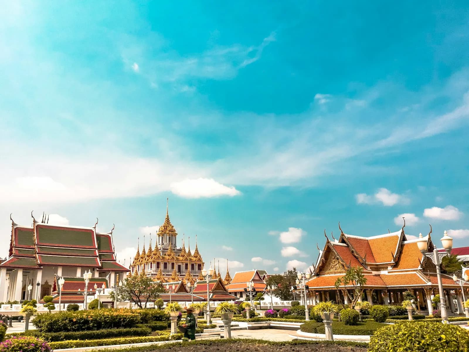 Bangkok — Wat Arun · the spires of Wat Arun, the Temple of Dawn, rising over the Chao Phraya river
